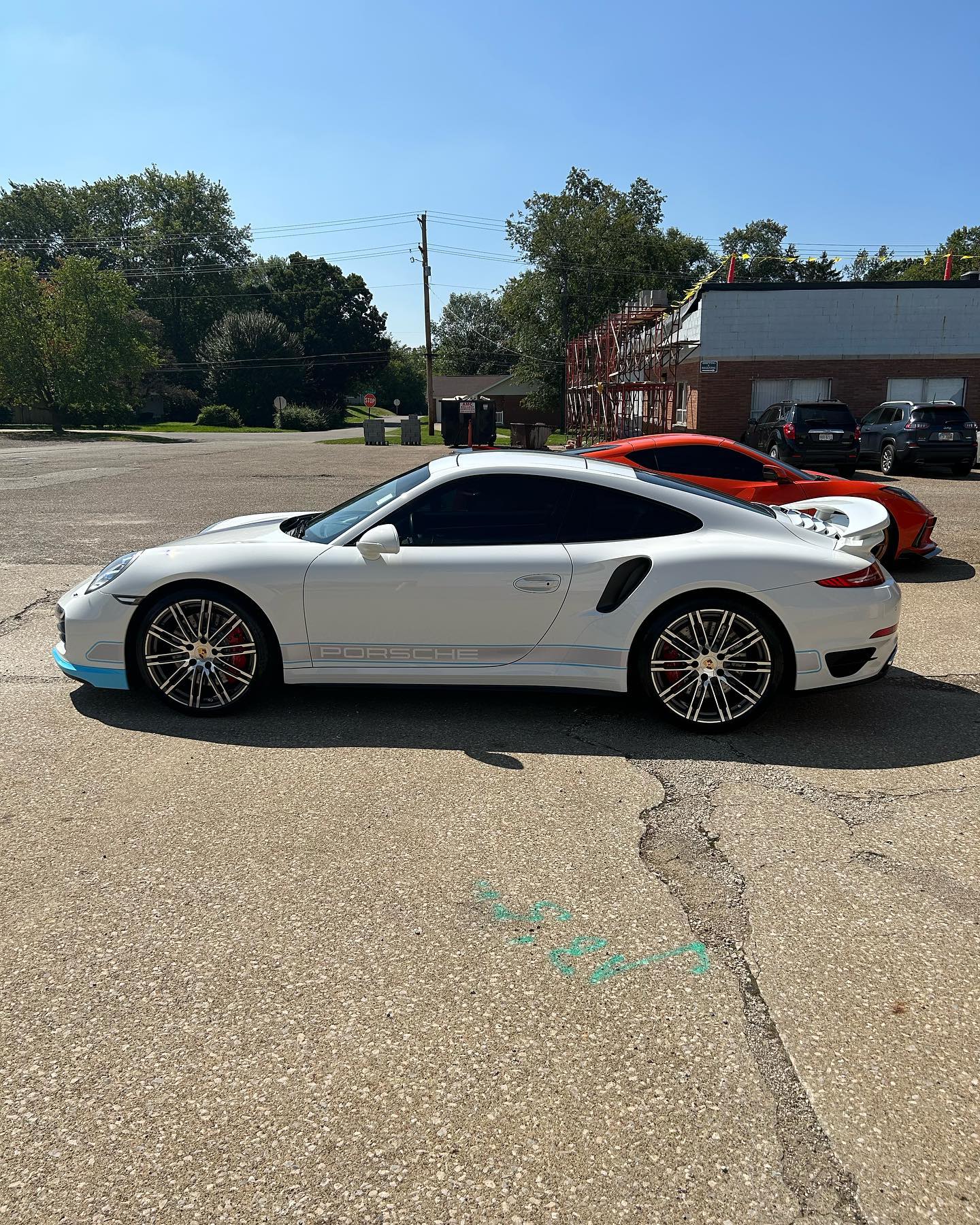 Porsche 911 Turbo S in white, side profile