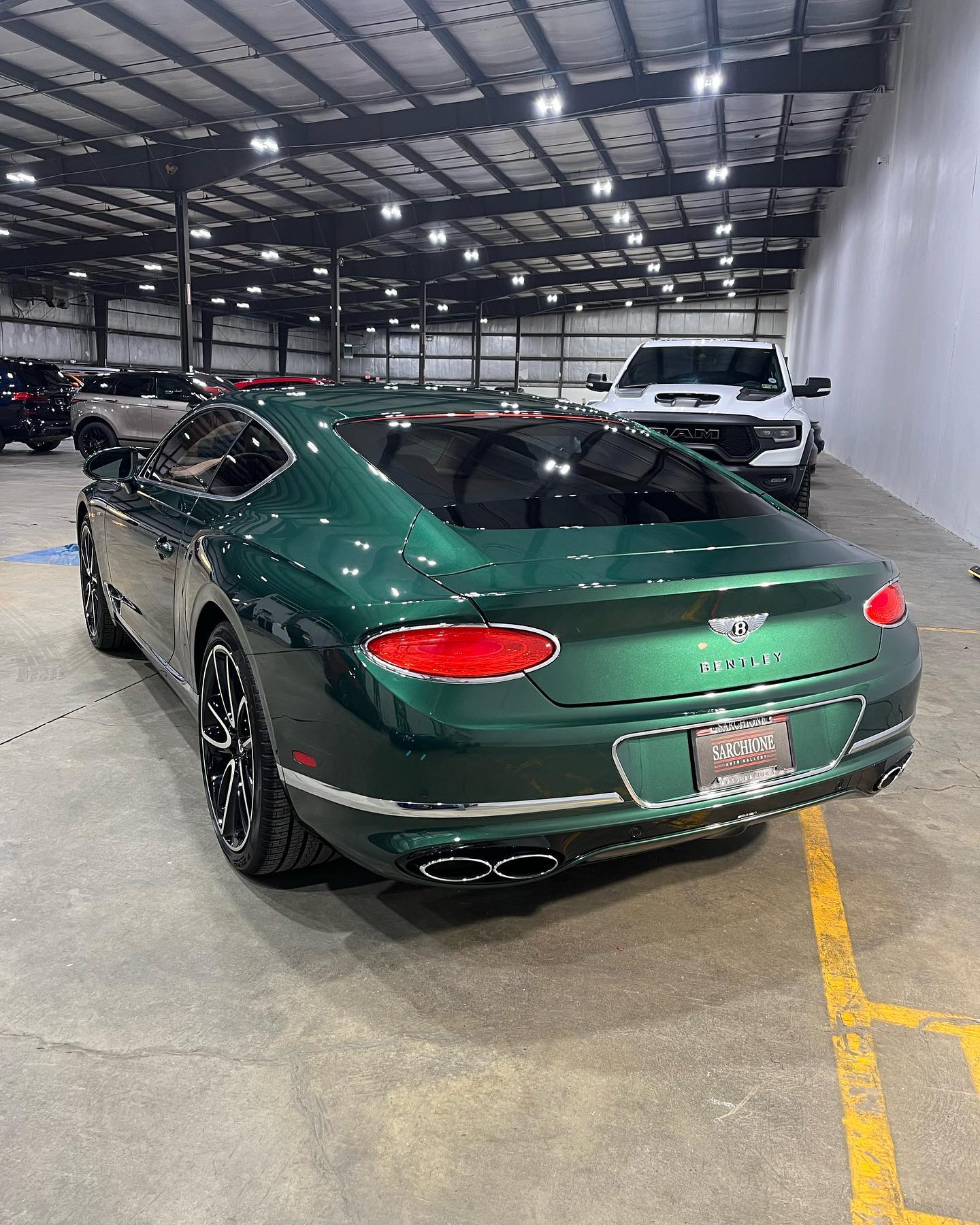 Bentley Continental GT in British Racing Green, rear three-quarter