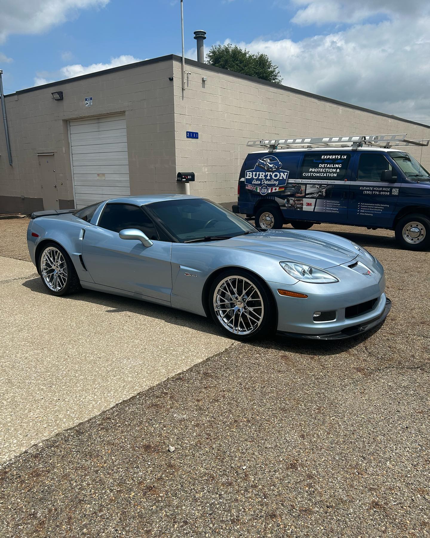 Chevrolet Corvette C6 ZR1 in Supersonic Blue with Burton van in background