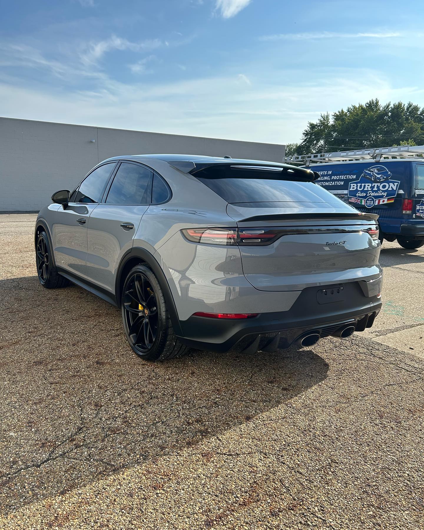 Porsche Cayenne GT in Arctic Grey, Burton van in background